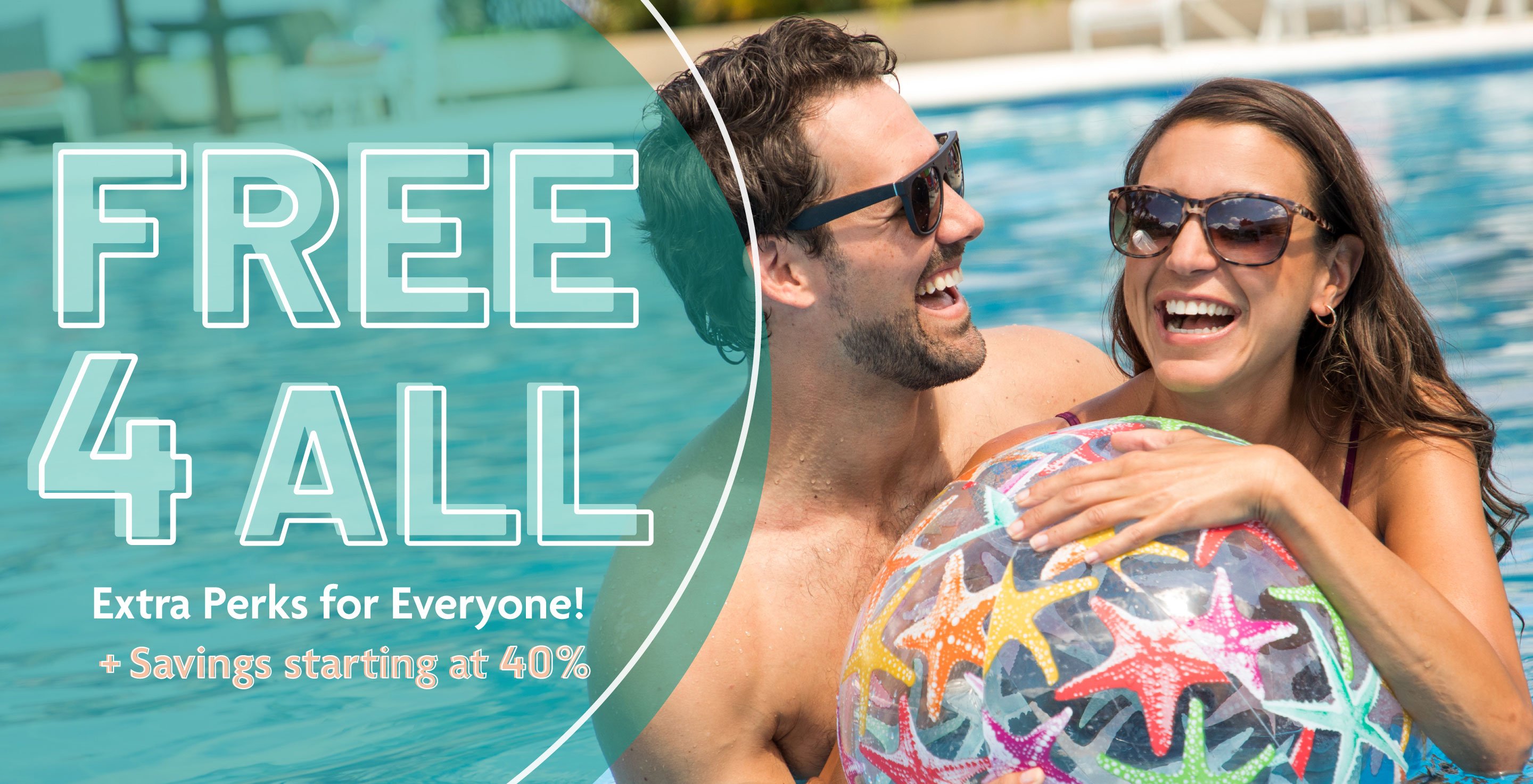 Couple having fun in pool with beach ball Couple having fun in pool with beach ball